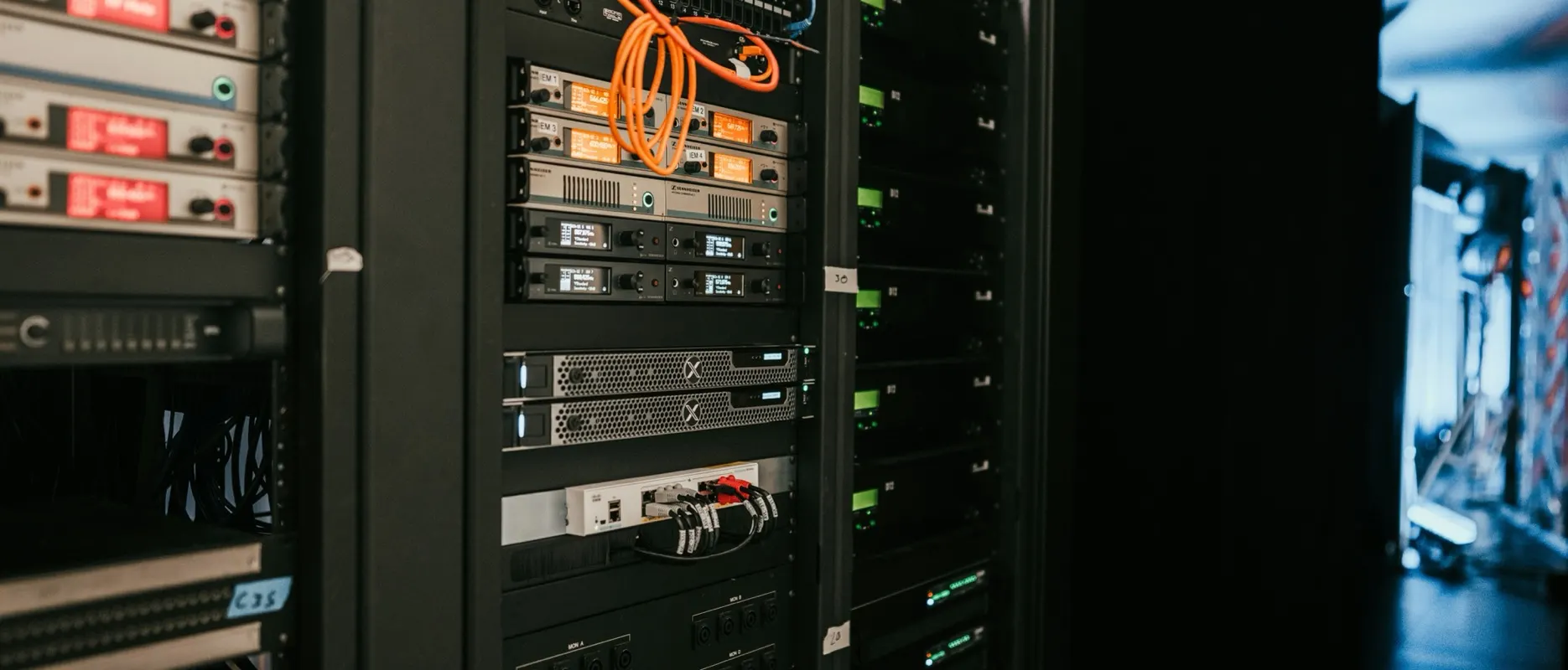 A server rack in a server room, with equipment and cabling.